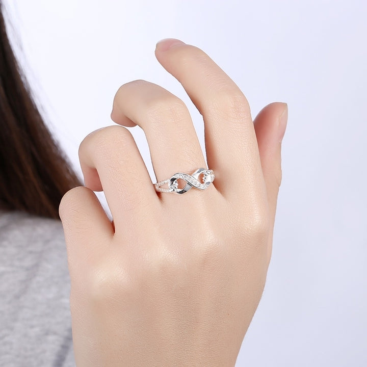 Simulated CZ Diamond Infinity Ring in 18K White Gold Image 3