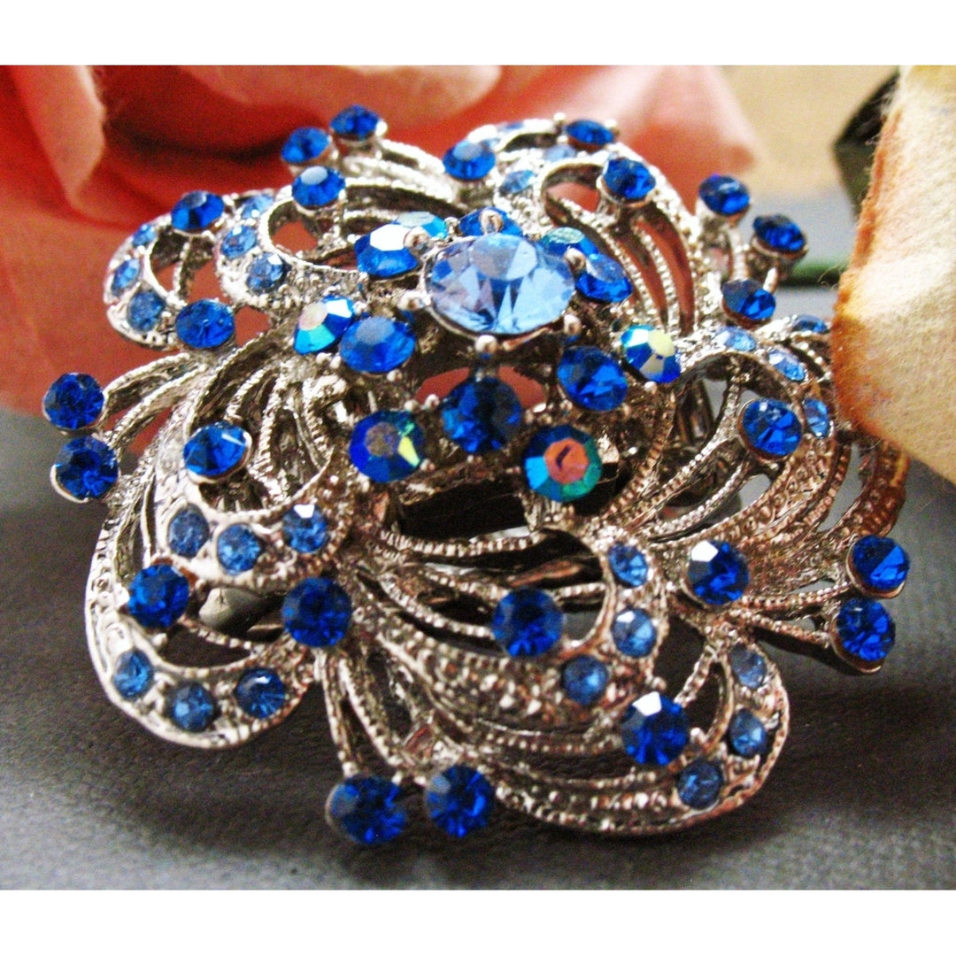 Blue Swirl Flower Stretch Ring Sparkling Silver Toned Blooming Flower Blue Crystals Ring Image 1