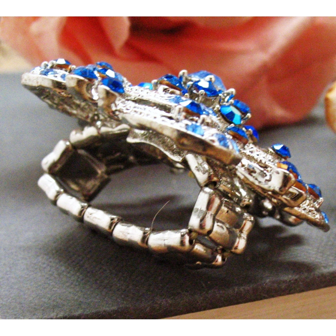 Blue Swirl Flower Stretch Ring Sparkling Silver Toned Blooming Flower Blue Crystals Ring Image 3
